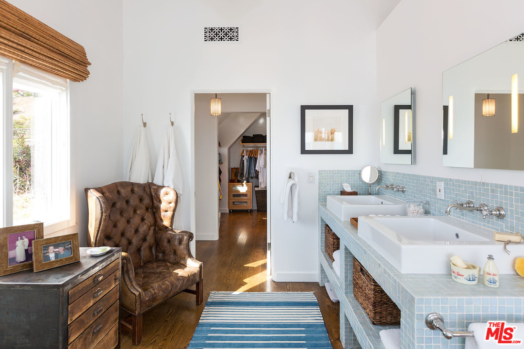 21644 Pacific Coast Highway Malibu, CA 90265 - Photo 47 of 53 a living room with furniture and a wooden floor