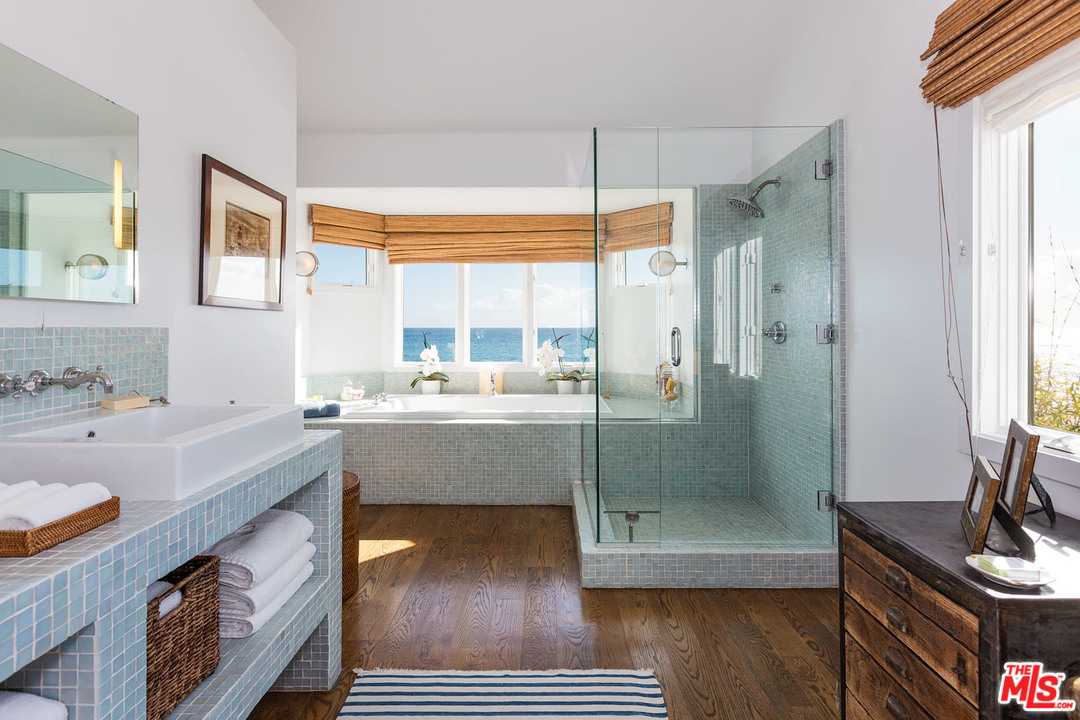 21644 Pacific Coast Highway Malibu, CA 90265 - Photo 48 of 53 a bathroom with a tub sink and mirror