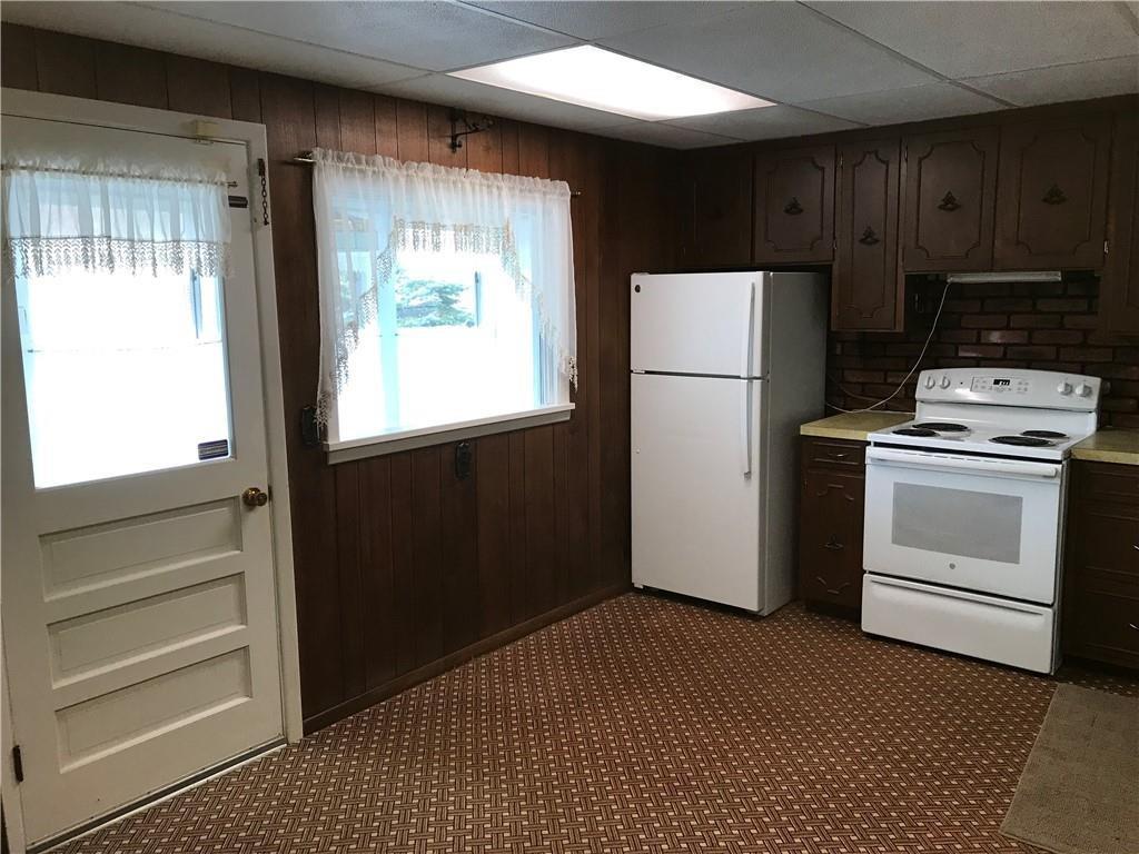 10202 Cutter Road Meadville, PA 16335 - Photo 8 of 9 a kitchen with a refrigerator and window