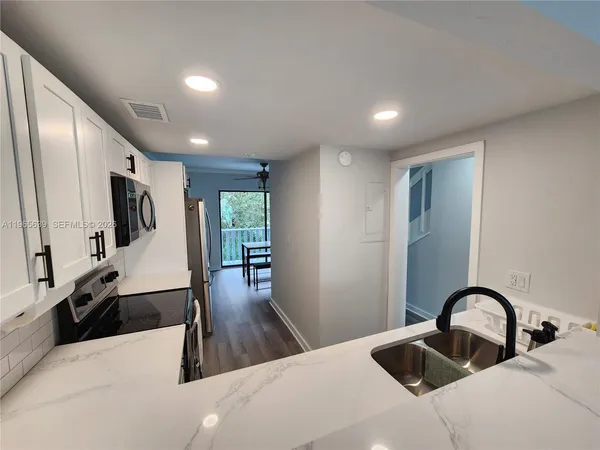a very nice looking dining room with a large window
