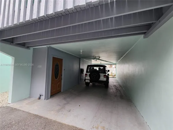 a view of empty room with furniture
