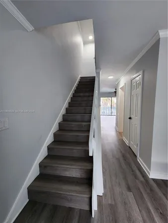 a view of gallery with wooden floor