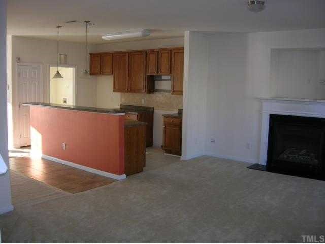 519 Stern Wheel Way Knightdale, NC 27545 - Photo 2 of 2 a kitchen with stainless steel appliances granite countertop a stove a refrigerator and a oven