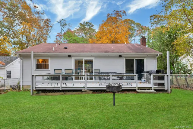 a front view of house with yard and outdoor seating