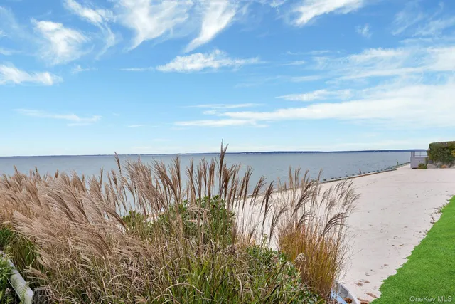 a view of a water with a building in background