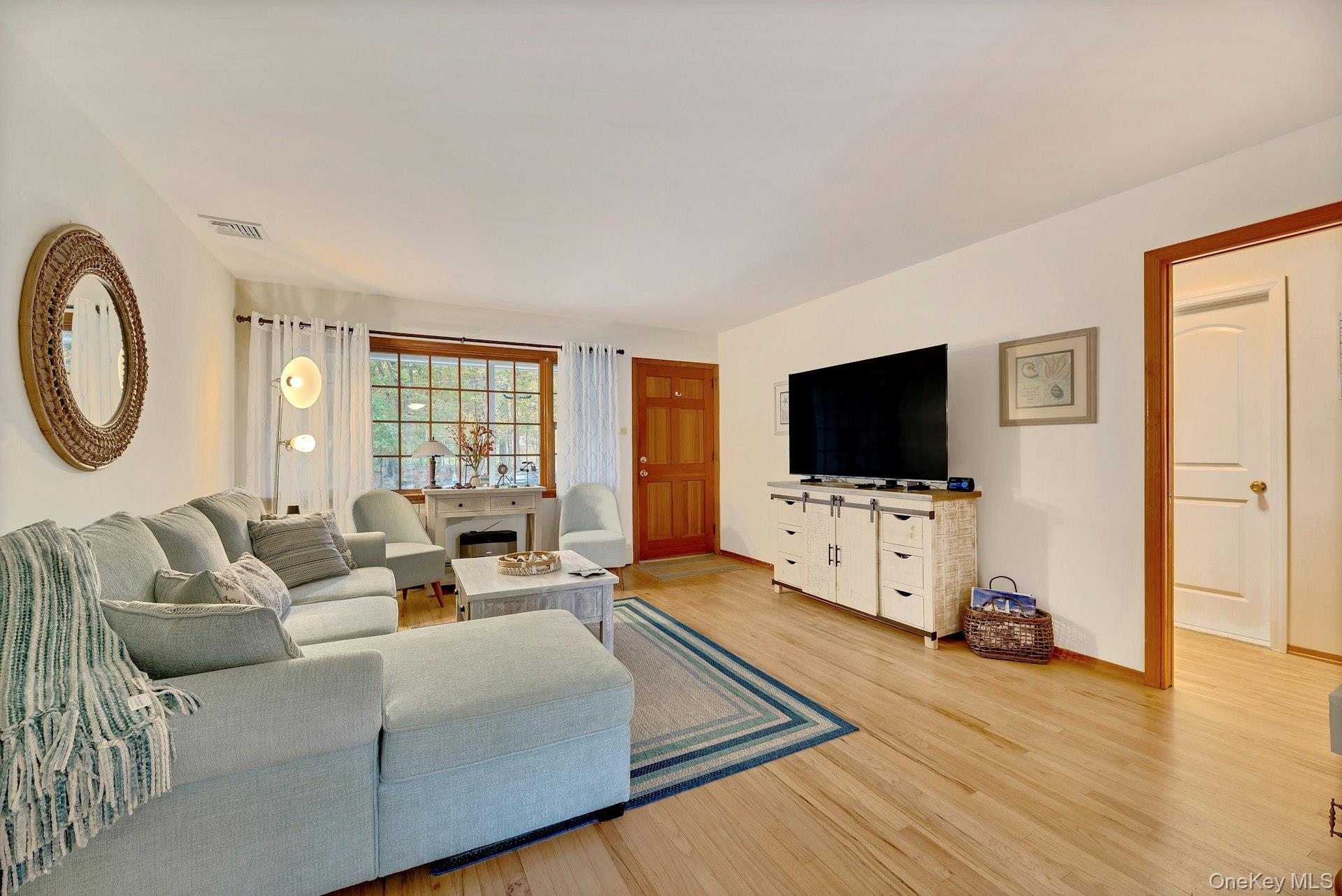 210 3rd Street Laurel, NY 11948 - Photo 6 of 22 Living room featuring light wood-style floors