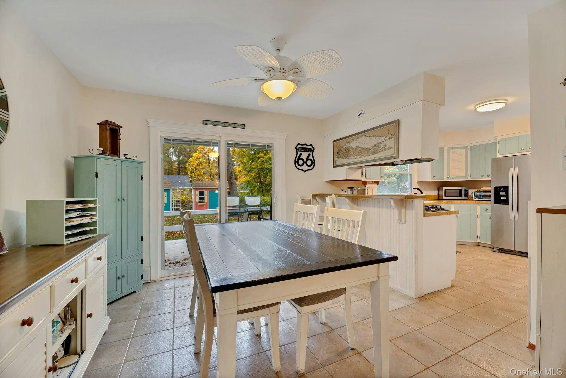 210 3rd Street Laurel, NY 11948 - Photo 7 of 22 Dining room featuring light tile patterned floors and ceiling fan