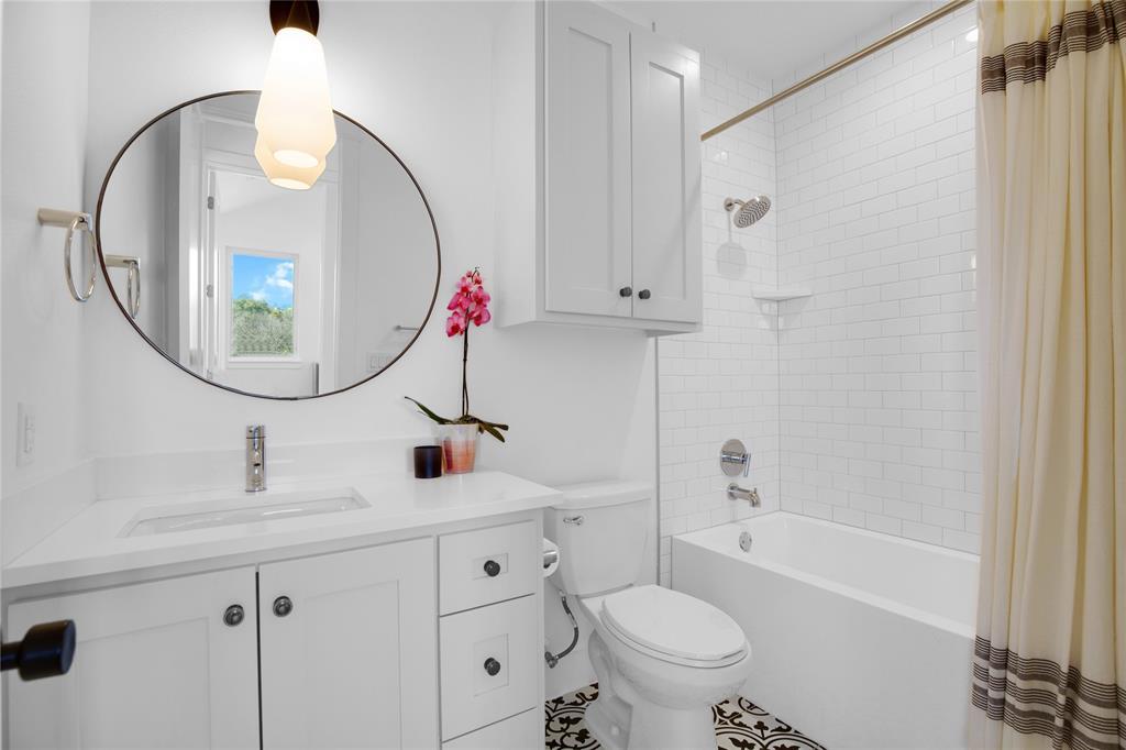 4020 Valley View Road, Unit A Austin, TX 78704 - Photo 11 of 17 Bathroom featuring vanity and shower / bath combination with curtain