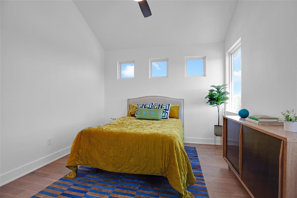 4020 Valley View Road, Unit A Austin, TX 78704 - Photo 13 of 17 Bedroom with vaulted ceiling, dark wood-type flooring, and a ceiling fan