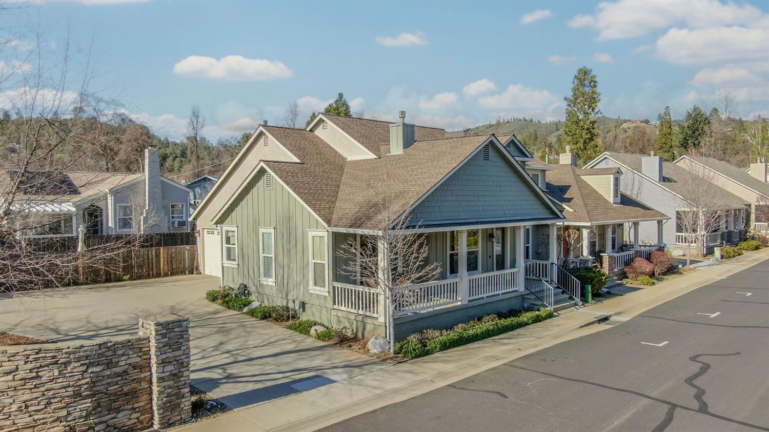 a view of a house with wooden fence