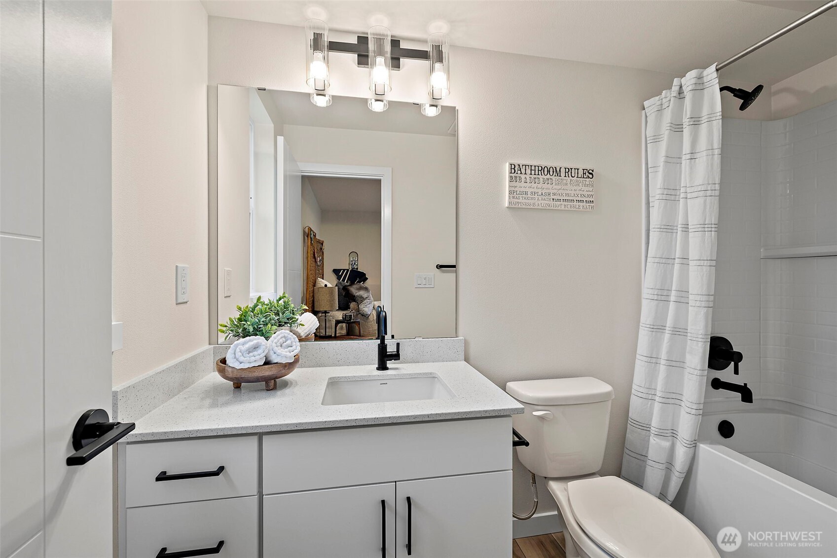 5015 144th Street Southwest, Unit C1 Edmonds, WA 98026 - Photo 26 of 36 a bathroom with a sink toilet a mirror and shower
