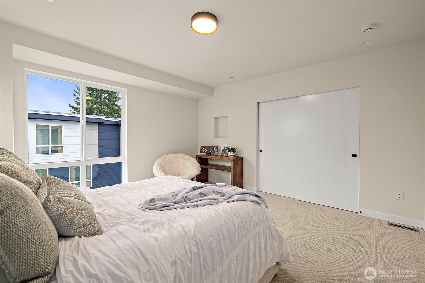 5015 144th Street Southwest, Unit C1 Edmonds, WA 98026 - Photo 30 of 36 a bedroom with a bed and a large window