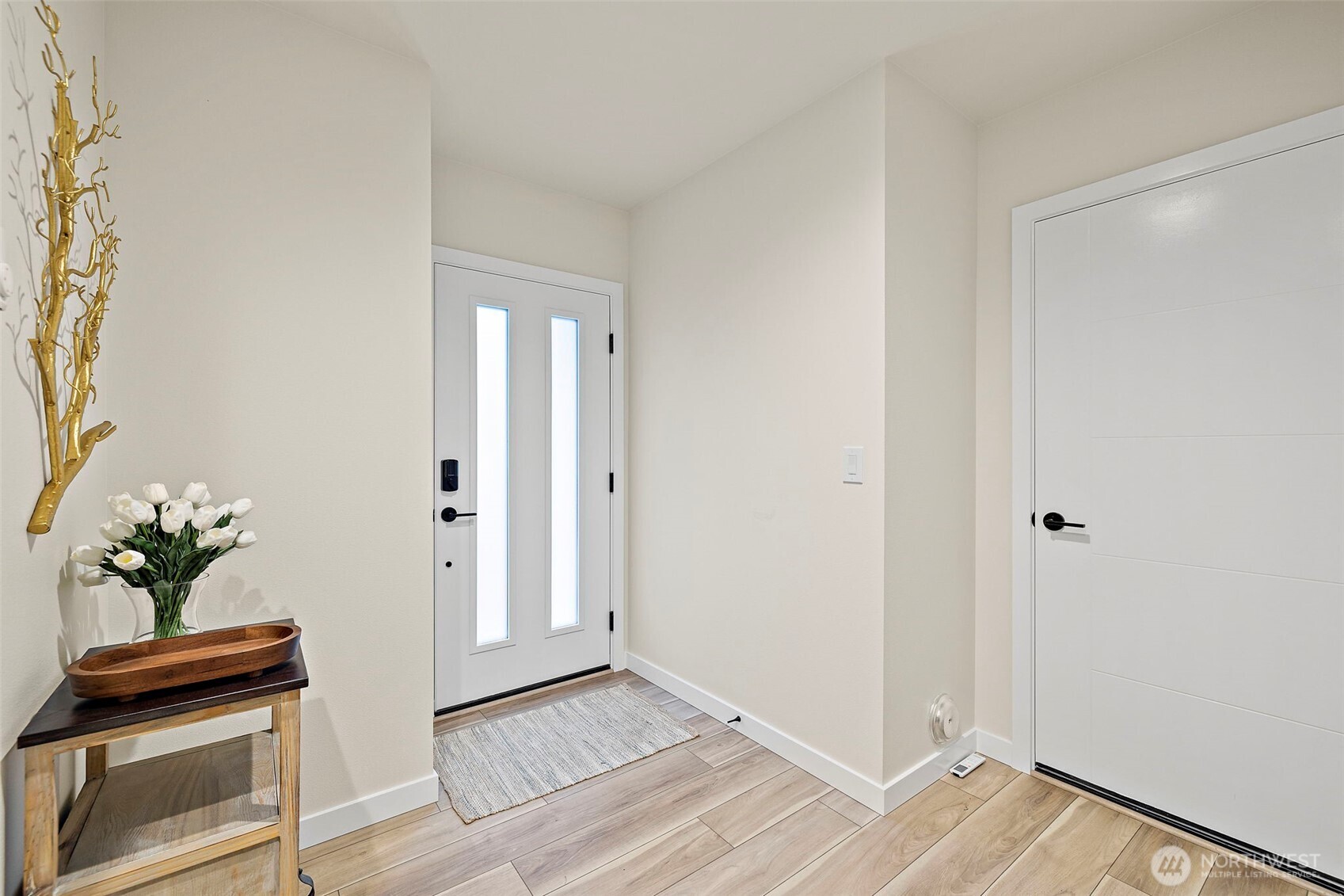5015 144th Street Southwest, Unit C1 Edmonds, WA 98026 - Photo 4 of 36 a view of an entryway with wooden floor