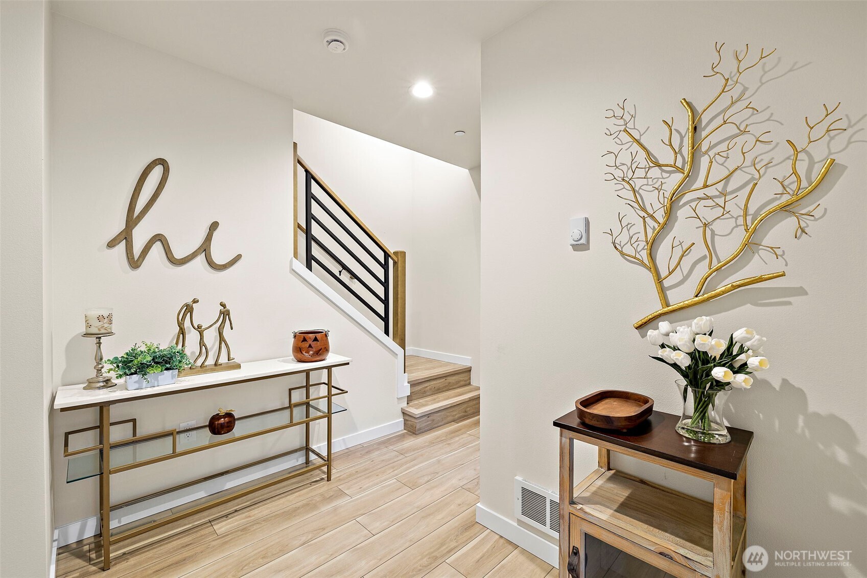 5015 144th Street Southwest, Unit C1 Edmonds, WA 98026 - Photo 5 of 36 a hallway with a potted plant in front of it