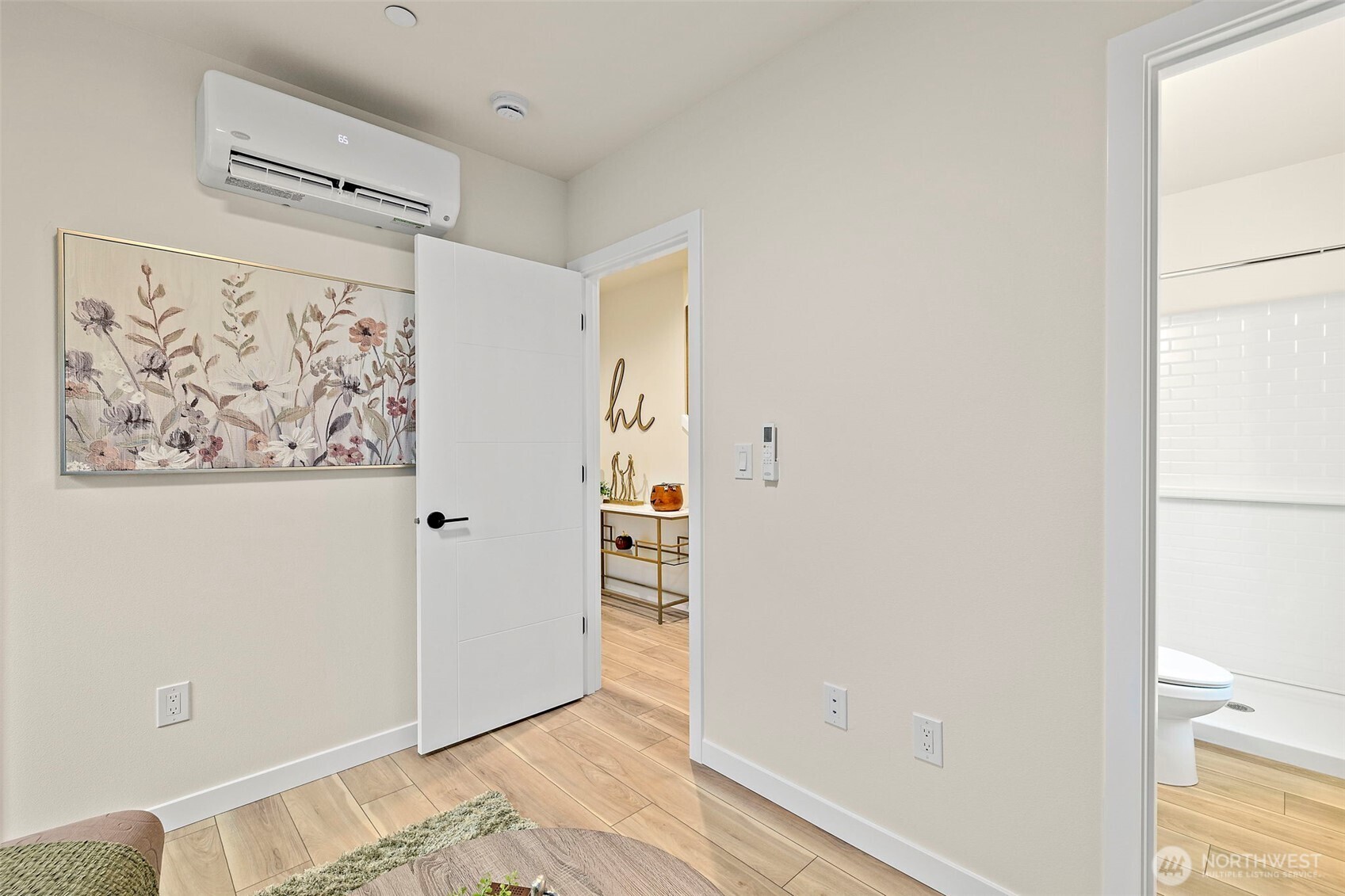 5015 144th Street Southwest, Unit C1 Edmonds, WA 98026 - Photo 7 of 36 a view of a hallway with wooden floor and closet
