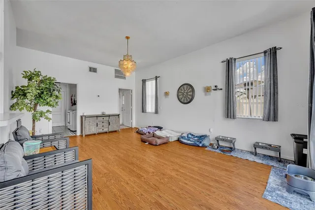 a kitchen with granite countertop a stove top oven and cabinets