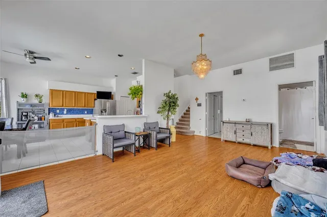 a kitchen with cabinets and stainless steel appliances