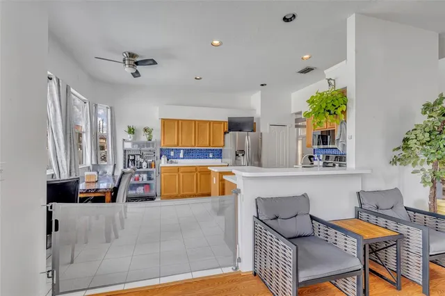 a bathroom with a sink a toilet and shower curtain
