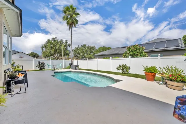 an aerial view of residential houses with outdoor space and street view
