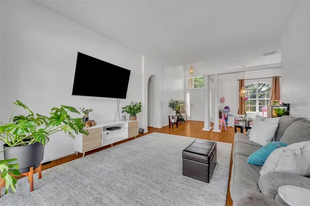 a bed room with a bed and a chandelier