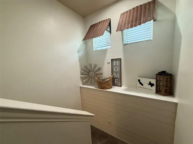 a view of hallway with stairs