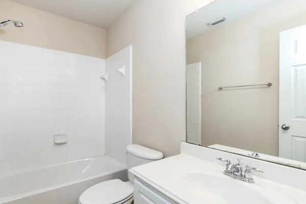 an empty room with closet area