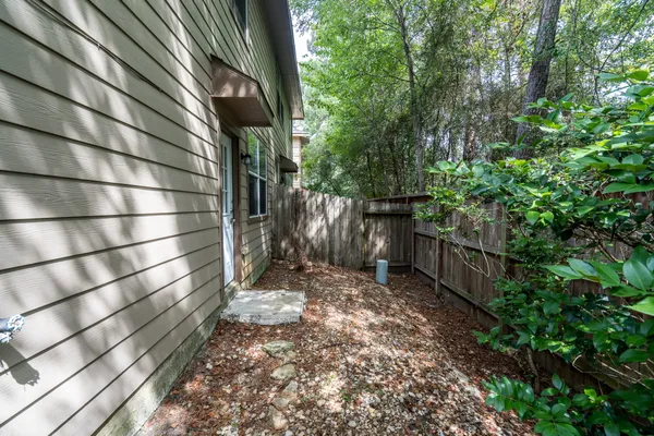 a view of wooden fence with trees
