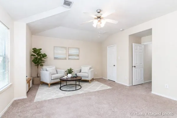 a kitchen with granite countertop a sink stove and refrigerator