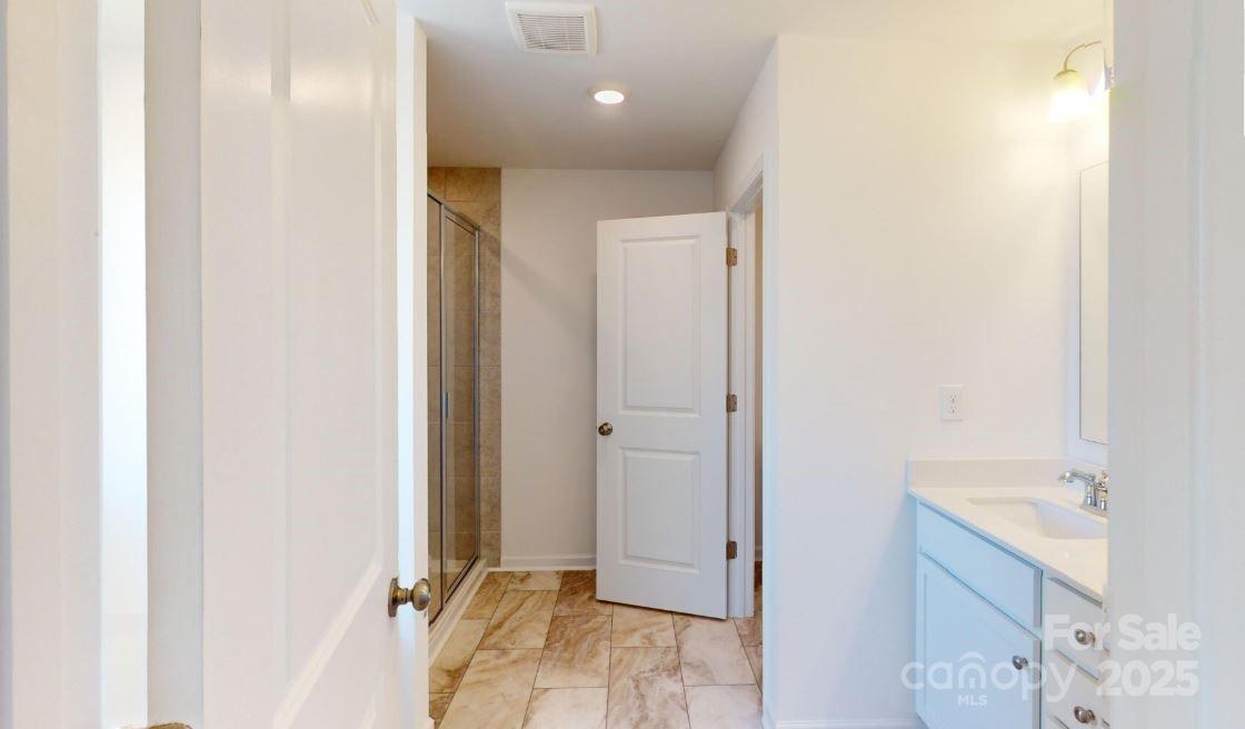 1805 Augustine Street Monroe, NC 28112 - Photo 17 of 17 a view of a bathroom from a hallway