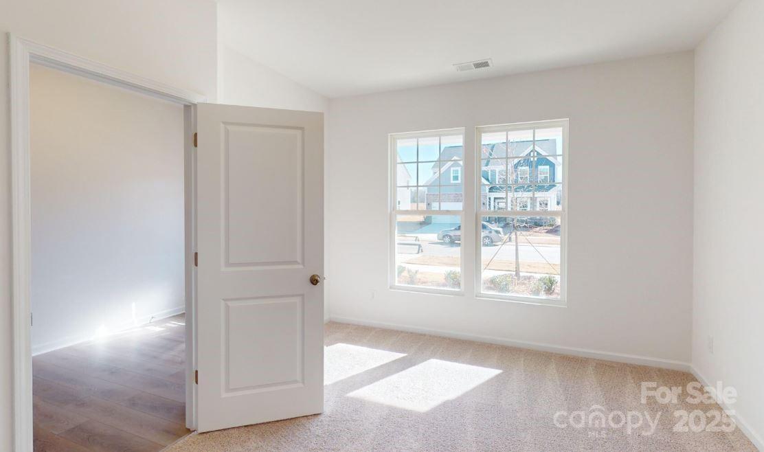 1805 Augustine Street Monroe, NC 28112 - Photo 3 of 17 a view of an empty room with a window