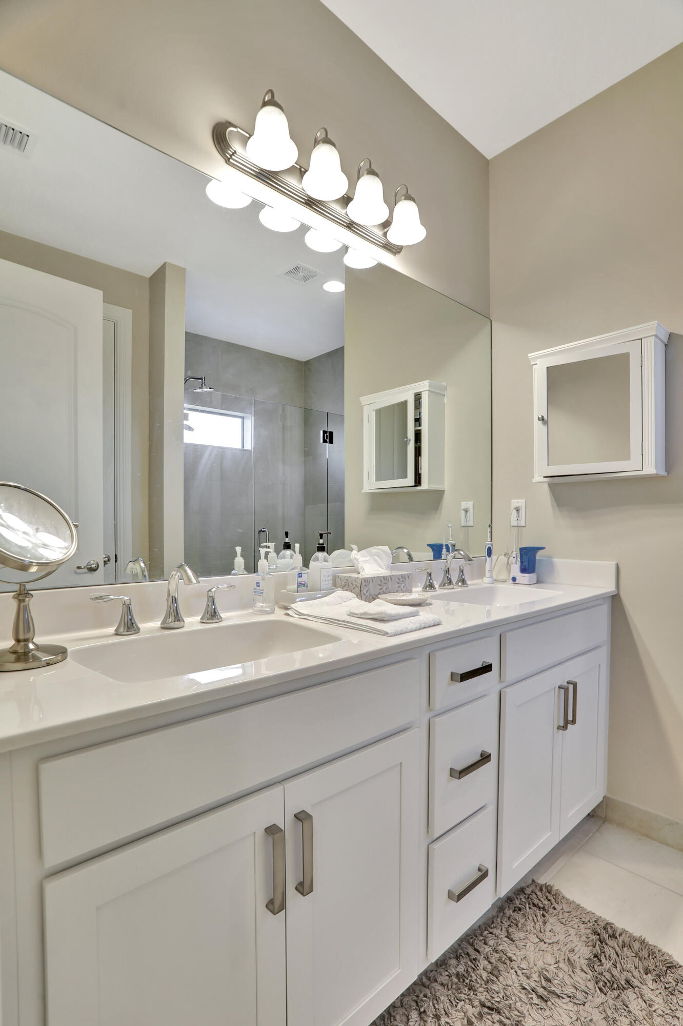 9517 Glider Way Boca Raton, FL 33428 - Photo 29 of 60 a bathroom with a double vanity sink and a mirror