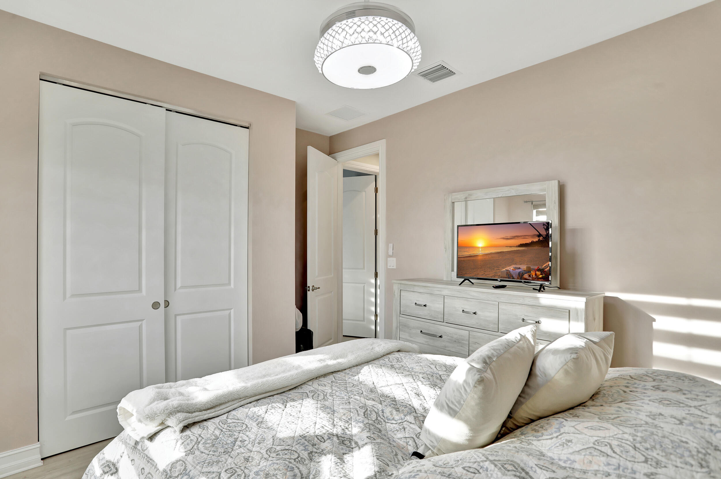 9517 Glider Way Boca Raton, FL 33428 - Photo 39 of 60 a bedroom with a bed and a flat screen tv