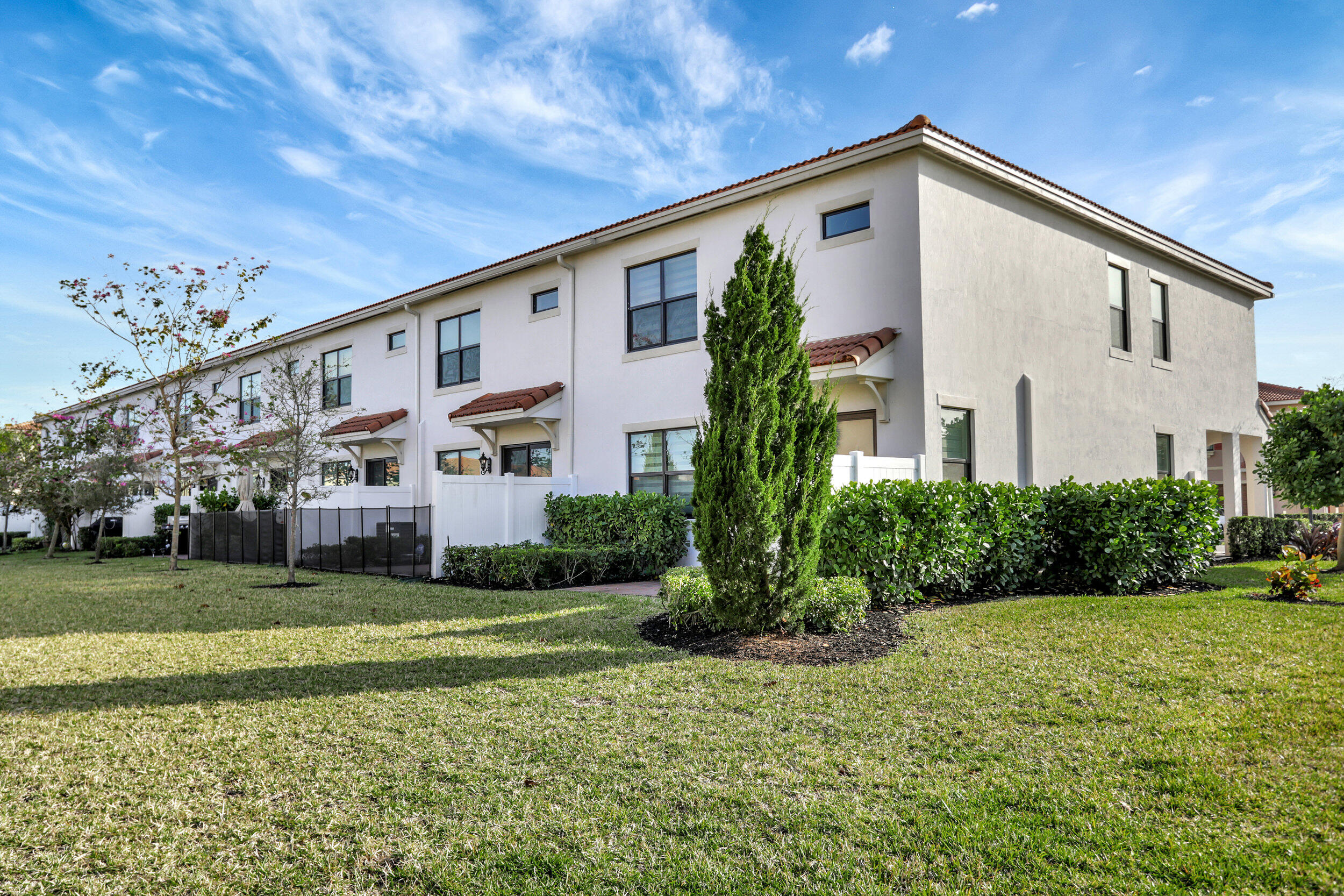9517 Glider Way Boca Raton, FL 33428 - Photo 4 of 60 a front view of a house with a yard