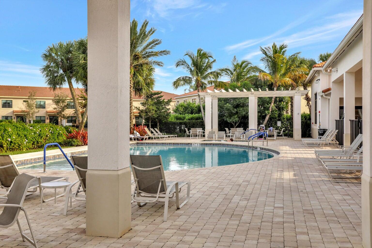 9517 Glider Way Boca Raton, FL 33428 - Photo 42 of 60 a view of a swimming pool with chairs