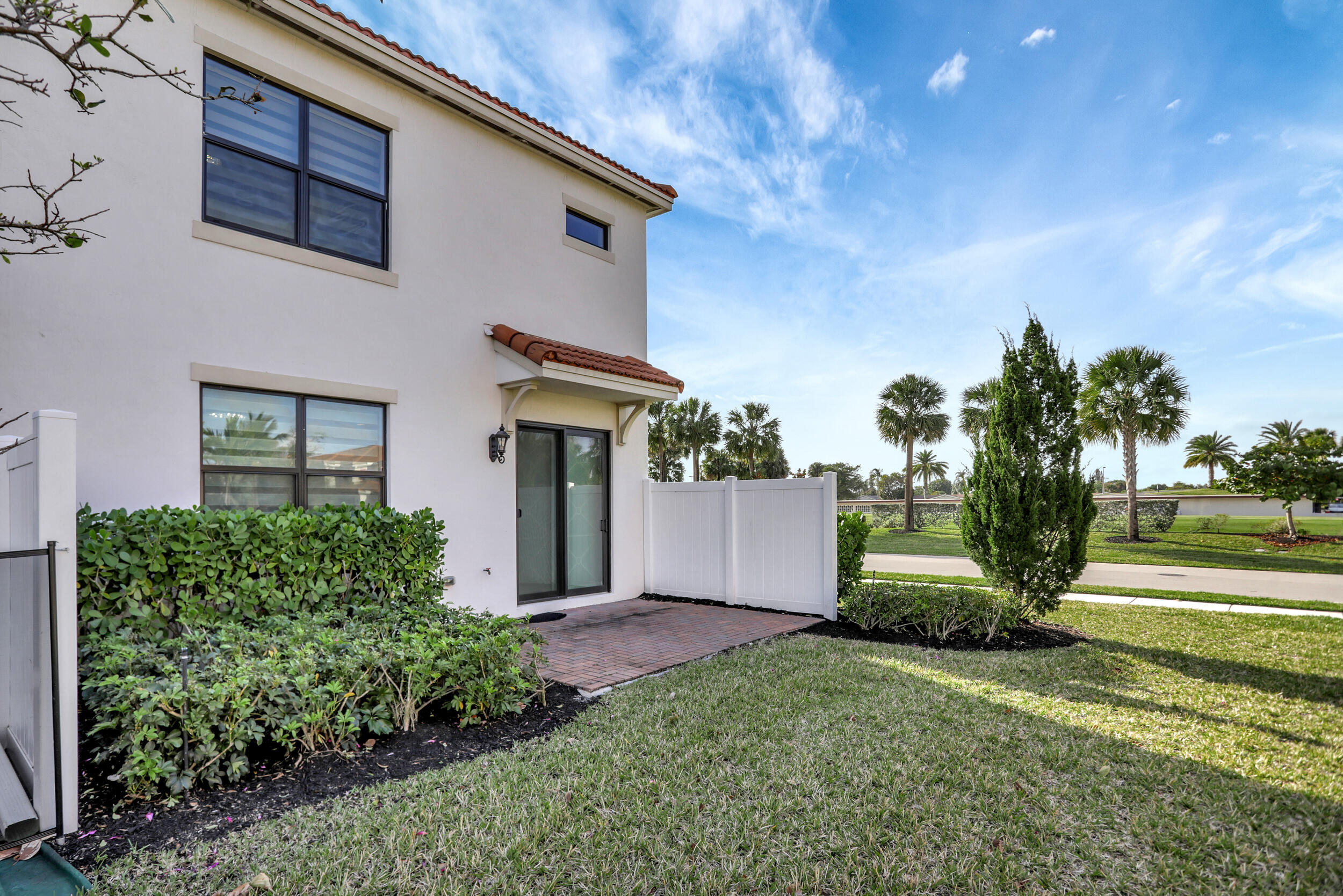 9517 Glider Way Boca Raton, FL 33428 - Photo 5 of 60 a front view of a house with a garden