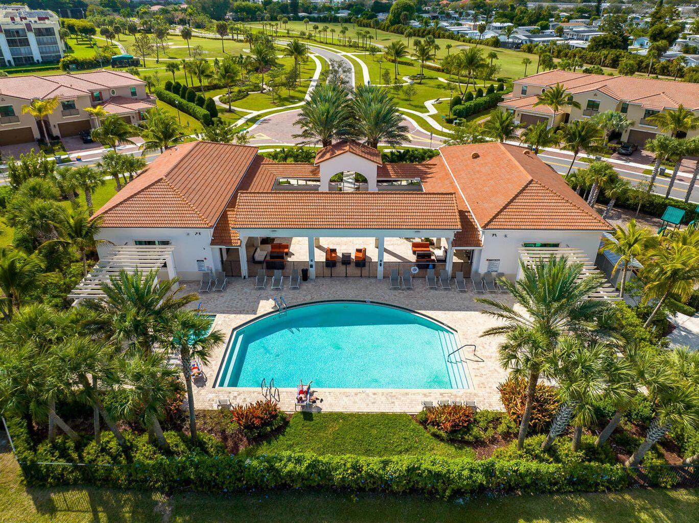 9517 Glider Way Boca Raton, FL 33428 - Photo 54 of 60 an aerial view of a house with a swimming pool patio and lake view