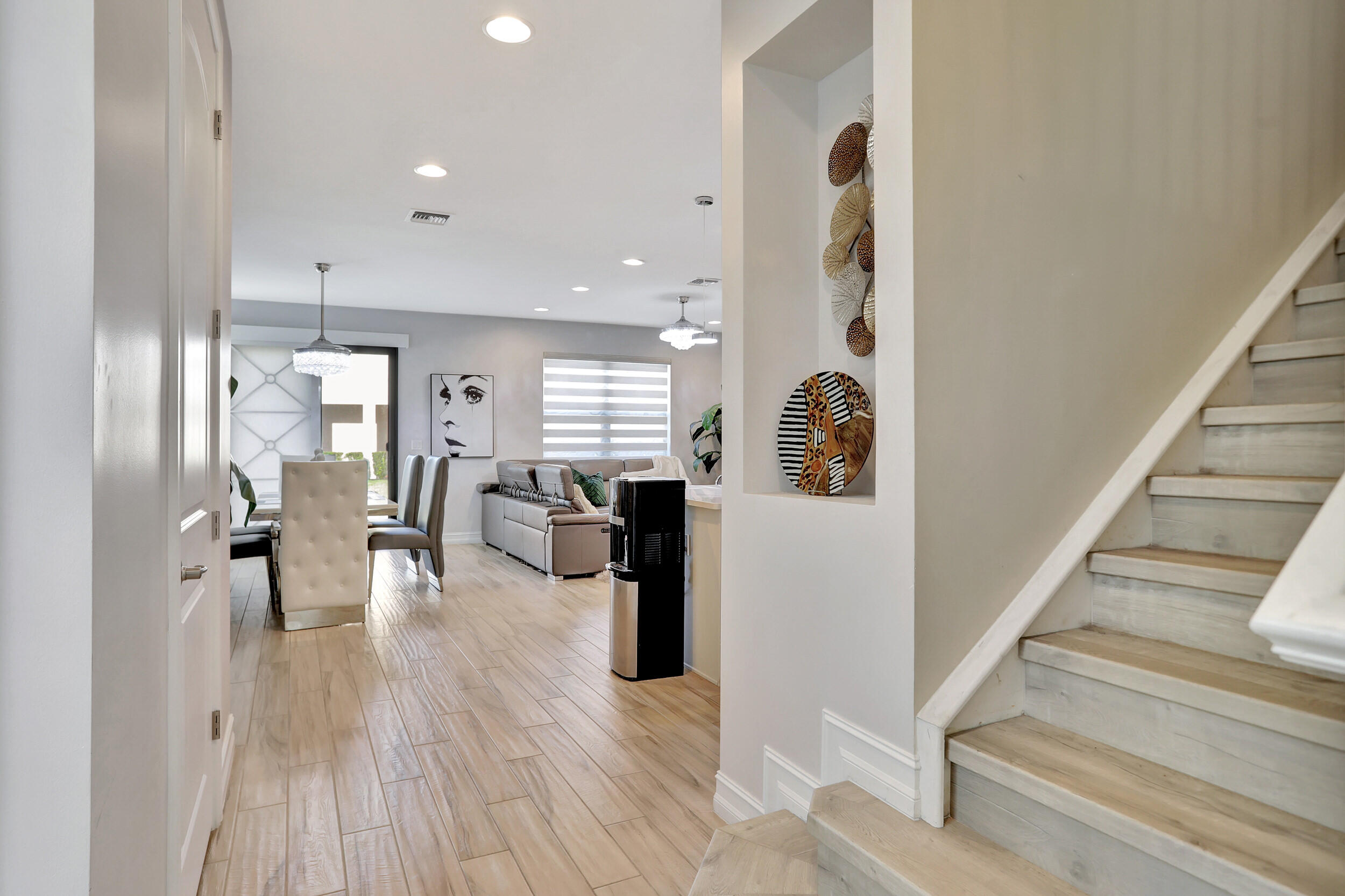 9517 Glider Way Boca Raton, FL 33428 - Photo 8 of 60 a view of a living room and entryway with wooden floor