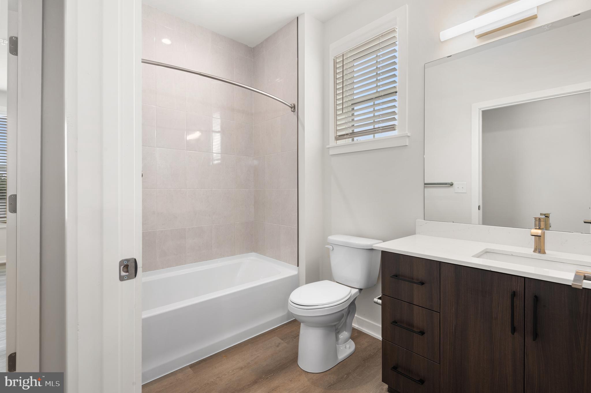 26 South York Road, Unit 401 Hatboro, PA 19040 - Photo 14 of 53 a bathroom with a sink toilet and shower