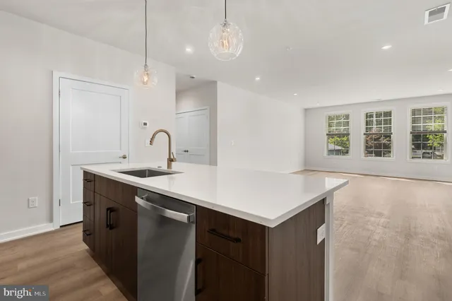 a kitchen with a sink cabinets and window