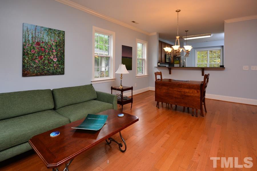 1524 North Duke Street Durham, NC 27701 - Photo 12 of 28 a living room with furniture and a chandelier