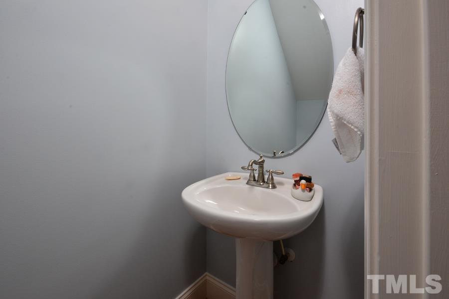 1524 North Duke Street Durham, NC 27701 - Photo 15 of 28 a bathroom with a sink and a mirror