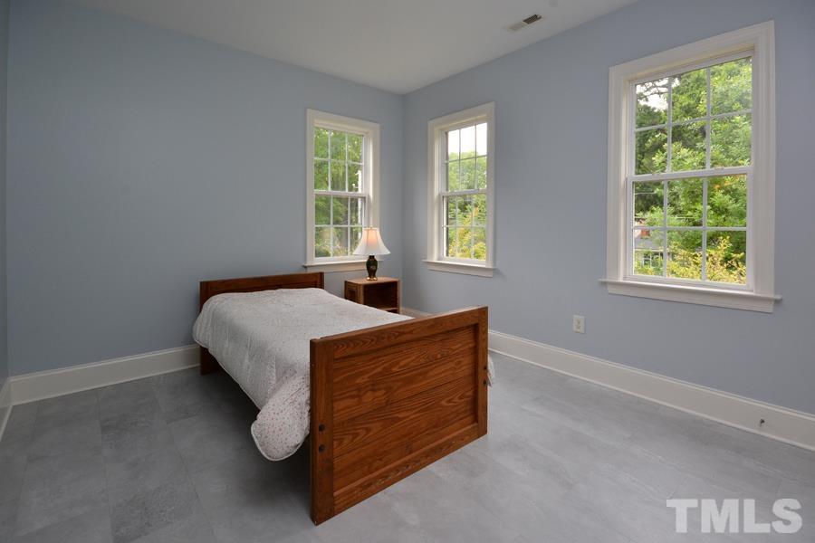 1524 North Duke Street Durham, NC 27701 - Photo 18 of 28 a bedroom with bed and window