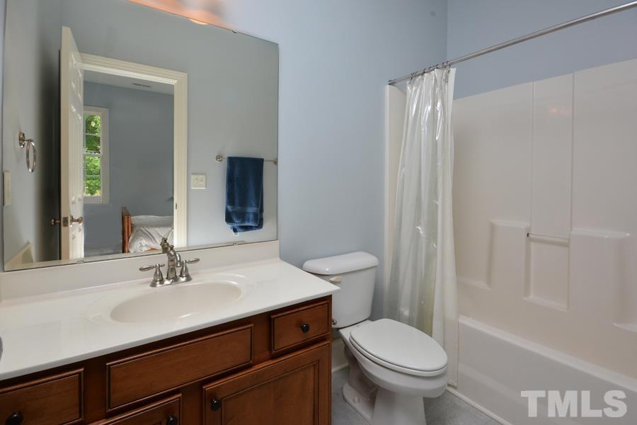 1524 North Duke Street Durham, NC 27701 - Photo 19 of 28 a bathroom with a sink toilet and shower