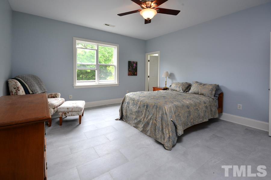 1524 North Duke Street Durham, NC 27701 - Photo 20 of 28 a bedroom with bed and window
