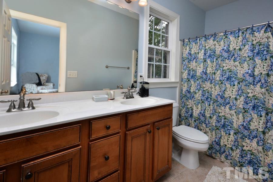 1524 North Duke Street Durham, NC 27701 - Photo 22 of 28 a bathroom with a sink toilet and shower