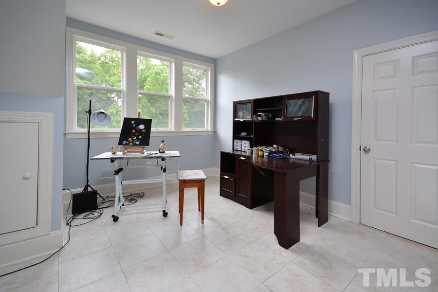 1524 North Duke Street Durham, NC 27701 - Photo 23 of 28 a view of a workspace with furniture and a window