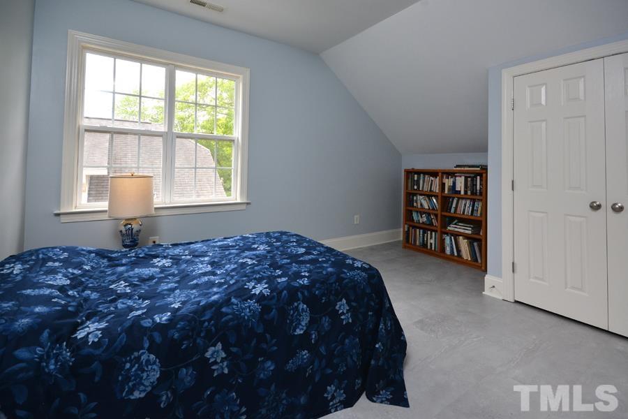 1524 North Duke Street Durham, NC 27701 - Photo 24 of 28 a bedroom with a bed and a window