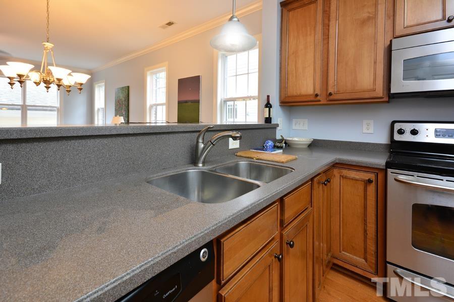 1524 North Duke Street Durham, NC 27701 - Photo 4 of 28 a kitchen with stainless steel appliances a sink a stove cabinets and a kitchen counter top