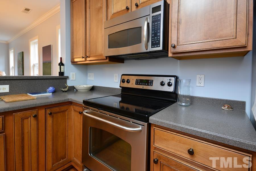 1524 North Duke Street Durham, NC 27701 - Photo 5 of 28 a kitchen with stainless steel appliances granite countertop a sink a stove and a microwave