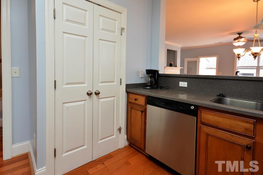 1524 North Duke Street Durham, NC 27701 - Photo 6 of 28 a kitchen with a sink and a refrigerator